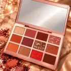 Open GOMAR Nude Eyeshadow Palette showing all 12 shades and mirror
