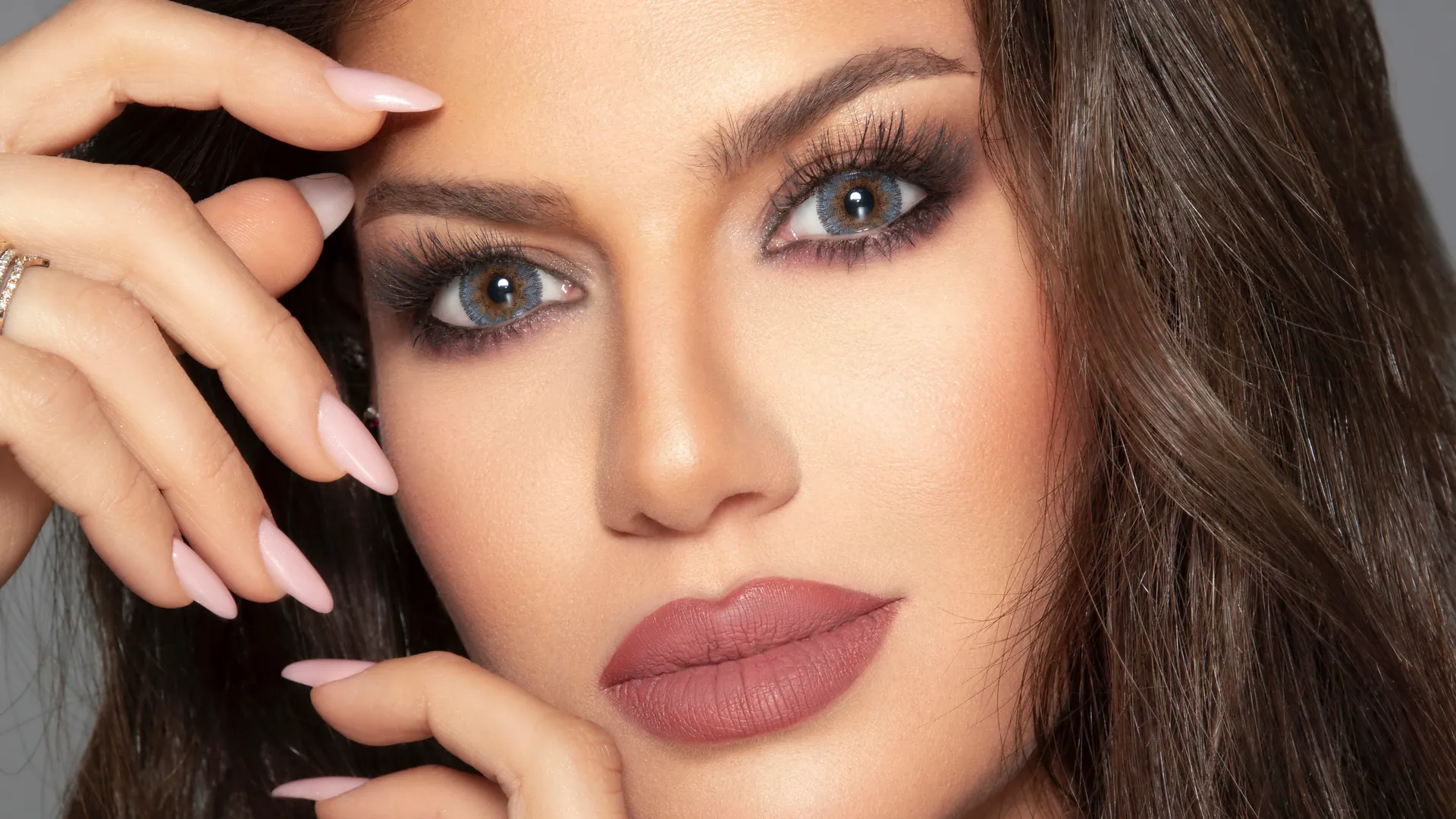 Close-up beauty portrait with blue-grey eyes